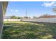 Fenced backyard with grassy area and room for outdoor activities at 310 Lake Mariana Pl, Auburndale, FL 33823