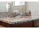 Bathroom vanity with granite countertop and chrome faucet at 310 Lake Mariana Pl, Auburndale, FL 33823