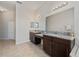 Double vanity bathroom with granite countertops at 310 Lake Mariana Pl, Auburndale, FL 33823
