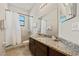 Bathroom with granite countertop and shower/tub combo at 310 Lake Mariana Pl, Auburndale, FL 33823