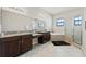 Spa-like bathroom with granite countertops and a soaking tub at 310 Lake Mariana Pl, Auburndale, FL 33823