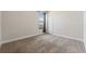 Simple bedroom with carpeted floors and window at 310 Lake Mariana Pl, Auburndale, FL 33823