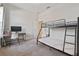 Bedroom with bunk beds and a workspace at 310 Lake Mariana Pl, Auburndale, FL 33823