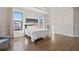 Bright bedroom with wood floors and large windows at 310 Lake Mariana Pl, Auburndale, FL 33823