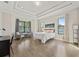 Spacious bedroom with large windows and wood flooring at 310 Lake Mariana Pl, Auburndale, FL 33823