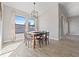Bright dining room with large windows and a wooden table at 310 Lake Mariana Pl, Auburndale, FL 33823