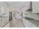 Bright kitchen with stainless steel appliances and granite countertops at 310 Lake Mariana Pl, Auburndale, FL 33823