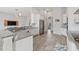 Open kitchen with island, granite counters & stainless steel appliances at 310 Lake Mariana Pl, Auburndale, FL 33823
