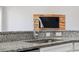 Modern kitchen sink and faucet with granite countertop at 310 Lake Mariana Pl, Auburndale, FL 33823