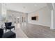 Spacious living area with hardwood floors and large windows at 310 Lake Mariana Pl, Auburndale, FL 33823