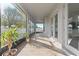 Relaxing screened porch with tile flooring and backyard views at 310 Lake Mariana Pl, Auburndale, FL 33823
