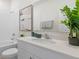 Clean bathroom with white cabinets and a bathtub at 3215 Arch Ave, Ormond Beach, FL 32174