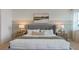 Main bedroom with plush bed and window lighting at 3215 Arch Ave, Ormond Beach, FL 32174
