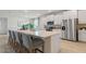 Modern kitchen with white cabinets, stainless steel appliances, and an island at 3215 Arch Ave, Ormond Beach, FL 32174