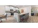 Modern kitchen with white cabinets, stainless steel appliances and island at 3215 Arch Ave, Ormond Beach, FL 32174