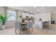 Open concept kitchen and dining area with island and seating at 3215 Arch Ave, Ormond Beach, FL 32174