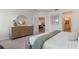 Main bedroom with dresser and view of living room at 3215 Arch Ave, Ormond Beach, FL 32174