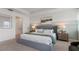 Main bedroom with gray bed and decorative wall at 3215 Arch Ave, Ormond Beach, FL 32174