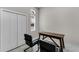 Home office with dual-door closet, transom window, and wooden desk with chairs at 3215 Arch Ave, Ormond Beach, FL 32174