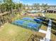 Aerial view of community pickleball courts provides an inviting space for friendly matches and neighborhood recreation at 3215 Arch Ave, Ormond Beach, FL 32174