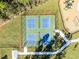 Aerial shot of community pickleball courts offers a fun and active space for residents to enjoy friendly matches and recreation at 3215 Arch Ave, Ormond Beach, FL 32174