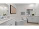 Bathroom with double vanity and corner tub at 3221 Arch Ave, Ormond Beach, FL 32174