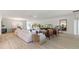 Spacious living room featuring light colored sofa and wood accent tables at 3221 Arch Ave, Ormond Beach, FL 32174