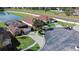 Two houses with solar panels, located near a pond and a road at 3233 Egrets Landing Dr, Lake Mary, FL 32746