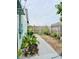 Landscaped backyard with a walkway and lush greenery at 3250 Dellbrook Dr, Deltona, FL 32738