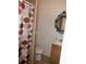 Compact bathroom with toilet, vanity, and shower with colorful curtain at 3250 Dellbrook Dr, Deltona, FL 32738