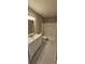 Bathroom with tub, toilet and vanity at 32712 Timberwood Dr, Leesburg, FL 34748