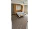 Bedroom with Murphy bed and ceiling fan at 32712 Timberwood Dr, Leesburg, FL 34748