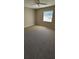 Bright bedroom with ceiling fan and window at 32712 Timberwood Dr, Leesburg, FL 34748