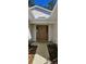 House entrance with brown door, walkway, and landscaping at 32712 Timberwood Dr, Leesburg, FL 34748