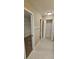 Hallway with double closets and tile floor at 32712 Timberwood Dr, Leesburg, FL 34748
