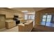 Eat-in kitchen with stainless steel appliances and breakfast bar at 32712 Timberwood Dr, Leesburg, FL 34748