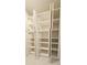 Open shelving and cabinets provide excellent storage in this laundry room at 32712 Timberwood Dr, Leesburg, FL 34748