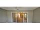 Sunroom with sliding glass doors leading to backyard at 32712 Timberwood Dr, Leesburg, FL 34748