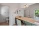 Vanity area with double sinks and large mirror at 3413 Lilas Ct, Windermere, FL 34786