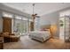 Spacious primary bedroom with sitting area and access to backyard at 3413 Lilas Ct, Windermere, FL 34786