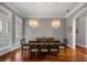 Formal dining room featuring hardwood floors and two chandeliers at 3413 Lilas Ct, Windermere, FL 34786