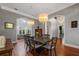 Elegant dining room with hardwood floors and chandelier at 3413 Lilas Ct, Windermere, FL 34786