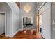 Grand entryway with hardwood floors, chandelier, and view to living room at 3413 Lilas Ct, Windermere, FL 34786