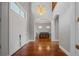 Bright entryway with hardwood floors and view of dining room at 3413 Lilas Ct, Windermere, FL 34786