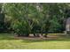 Peaceful fire pit area surrounded by trees at 3413 Lilas Ct, Windermere, FL 34786