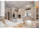 Modern kitchen featuring white cabinetry, marble countertops, and a large island at 3413 Lilas Ct, Windermere, FL 34786