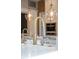 Close-up of a stylish gold kitchen sink and faucet at 3413 Lilas Ct, Windermere, FL 34786