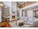 Open living room with hardwood floors, fireplace, and built-in shelves at 3413 Lilas Ct, Windermere, FL 34786