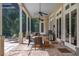 Outdoor patio with dining area and built-in grill at 3413 Lilas Ct, Windermere, FL 34786