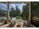 Relaxing pool area with covered patio and seating at 3413 Lilas Ct, Windermere, FL 34786